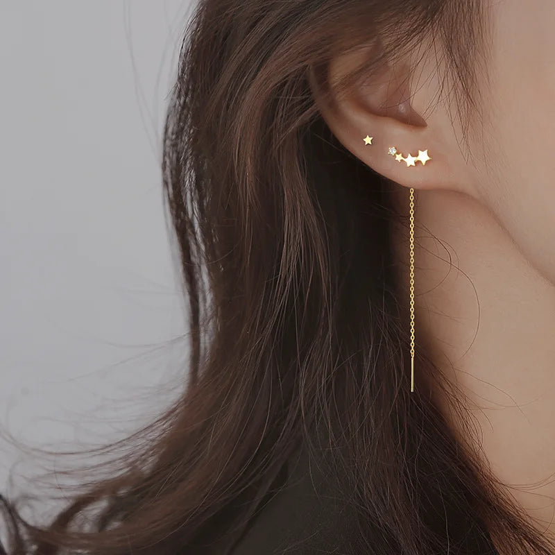 Boucles d’Oreilles Pendantes Etoilées
