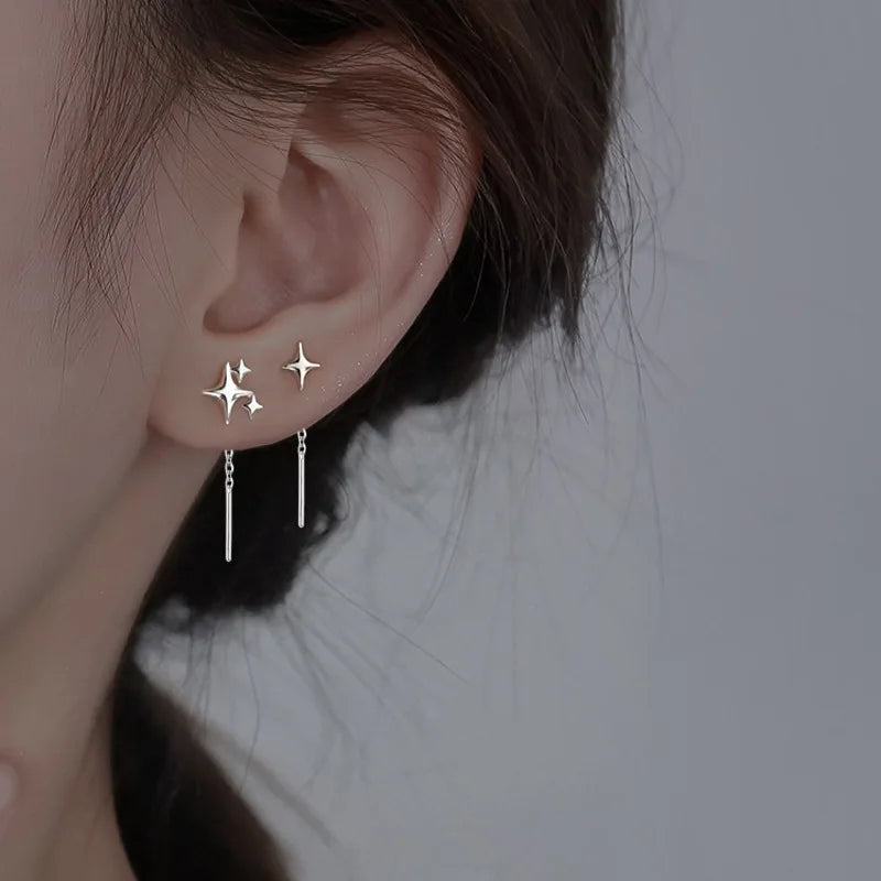 Boucles d’Oreilles Pendantes à Etoiles en Argent